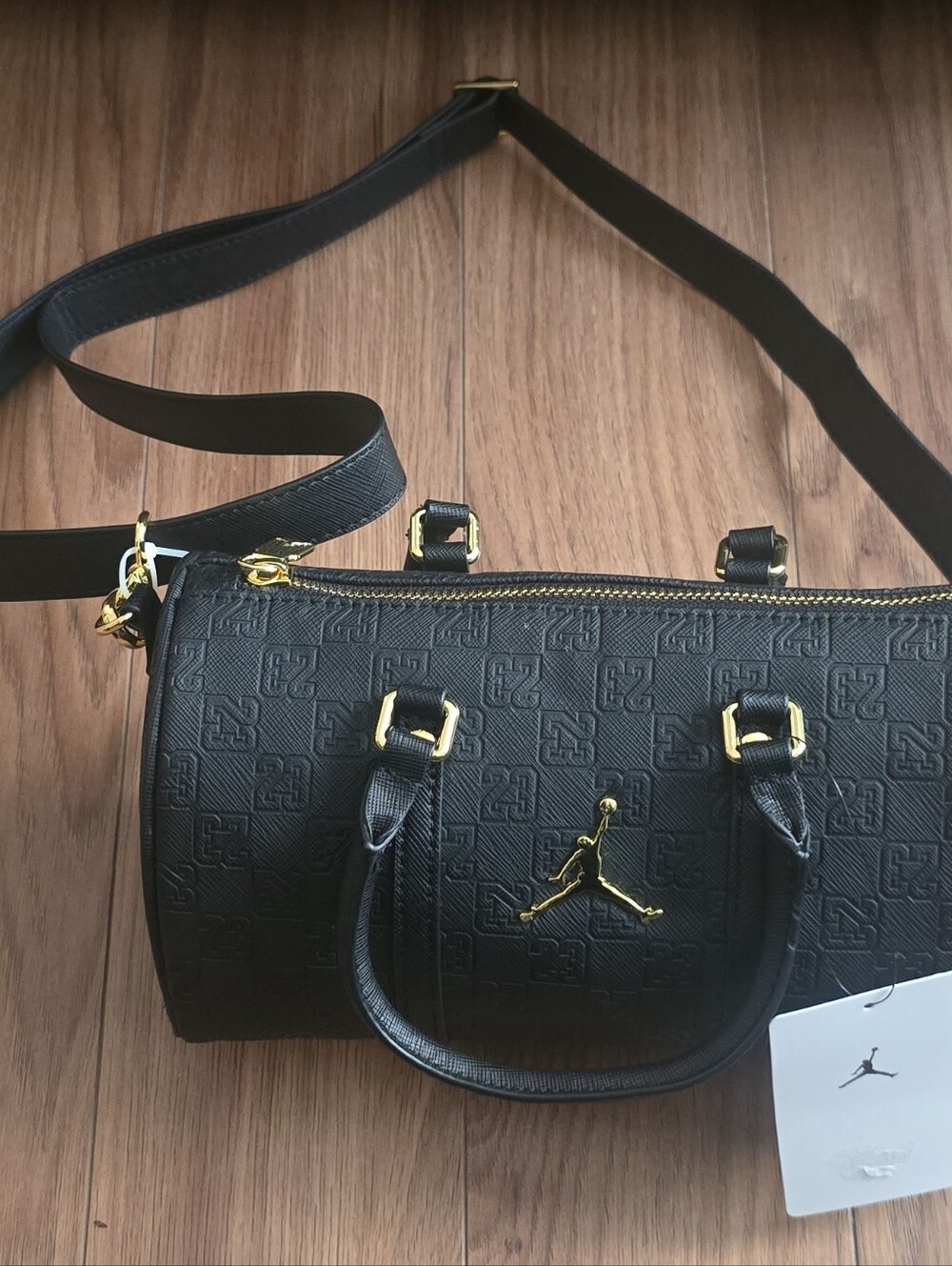 A black Jordan Monogram Mini Duffle Bag With Jump Man On It - Picture 10 of 10